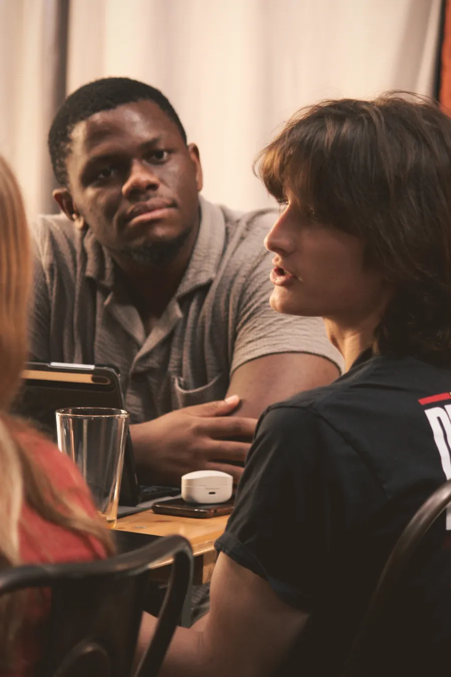 Writers in conversation around a table at an ATX Writing Club gathering